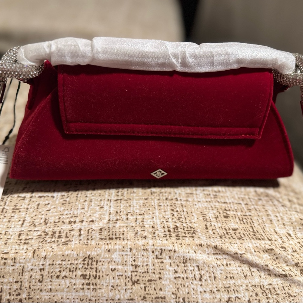 Red Clutch with Silver Detail and Flap Closure’s..